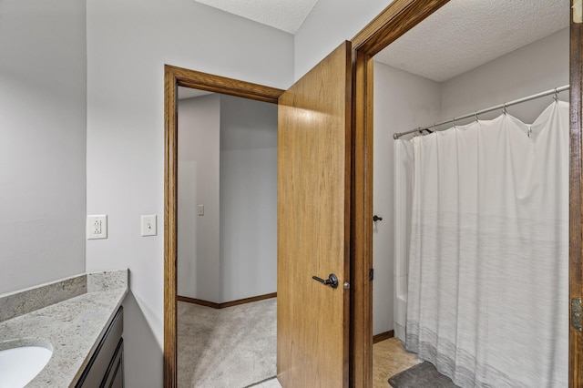 2801 263rd Ave NE, Isanti, MN 55040 - full bathroom featuring vanity, a textured ceiling, and shower / tub combo