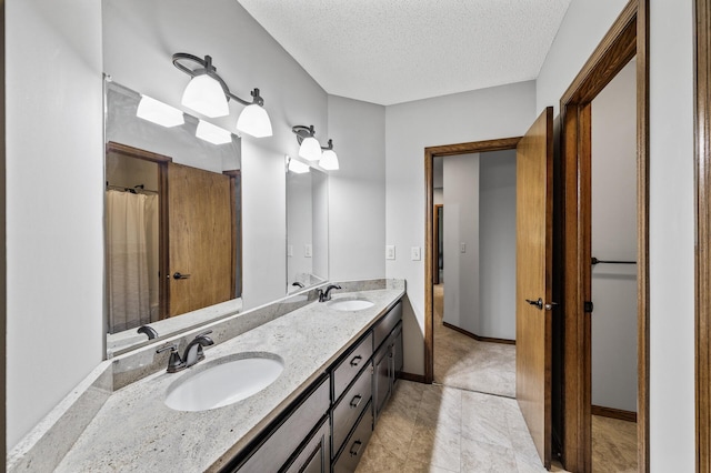 2801 263rd Ave NE, Isanti, MN 55040 - bathroom featuring double vanity and a textured ceiling
