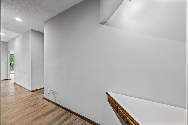 2801 263rd Ave NE, Isanti, MN 55040 - corridor with light wood-type flooring, recessed lighting, and a textured ceiling