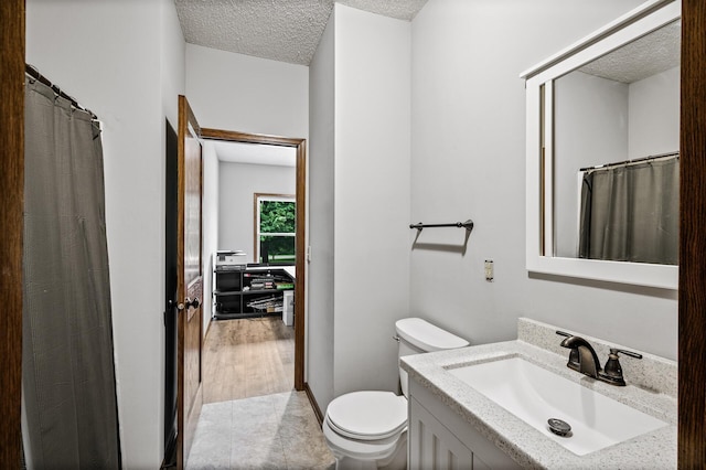 2801 263rd Ave NE, Isanti, MN 55040 - bathroom featuring vanity, a textured ceiling, and a shower with curtain