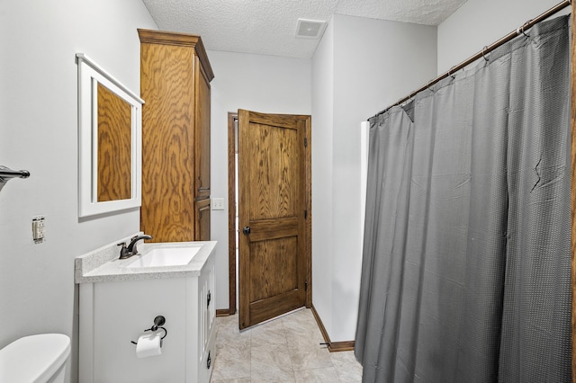 2801 263rd Ave NE, Isanti, MN 55040 - bathroom with vanity, a textured ceiling, and curtained shower