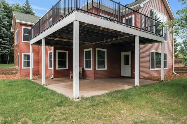 2801 263rd Ave NE, Isanti, MN 55040 - rear view of house with a yard, a wooden deck, and a patio