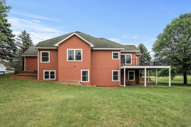 2801 263rd Ave NE, Isanti, MN 55040 - back of house with a lawn, a wooden deck, a patio area, and a shingled roof