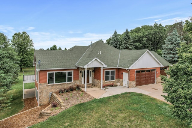 2801 263rd Ave NE, Isanti, MN 55040 - view of front facade featuring a garage, driveway, a front yard, roof with shingles, and stone siding