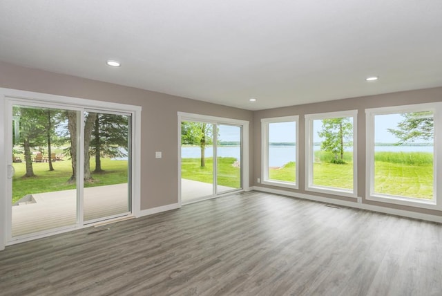 26877 Rainbow Ln, Merrifield, MN 56465 - unfurnished sunroom with a water view