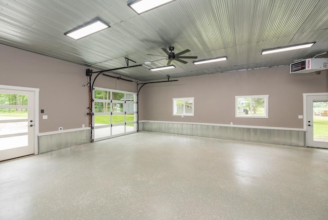 26877 Rainbow Ln, Merrifield, MN 56465 - garage with a wainscoted wall and ceiling fan