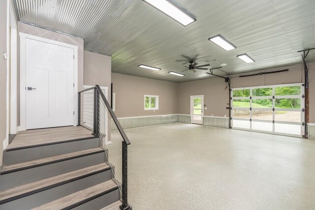 26877 Rainbow Ln, Merrifield, MN 56465 - garage with a wainscoted wall and ceiling fan