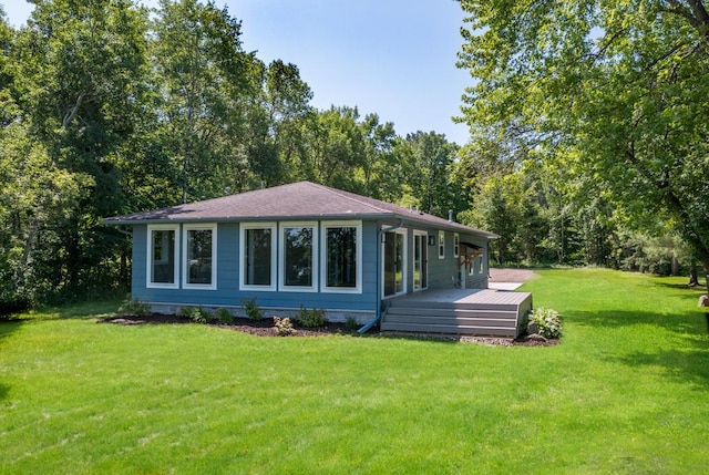 26877 Rainbow Ln, Merrifield, MN 56465 - back of house featuring a deck and a yard