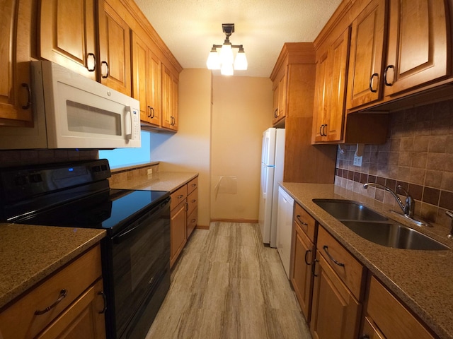 1181 Edgcumbe Rd Unit 709, Saint Paul, MN 55105 - kitchen featuring white appliances, brown cabinetry, light wood finished floors, tasteful backsplash, and a chandelier