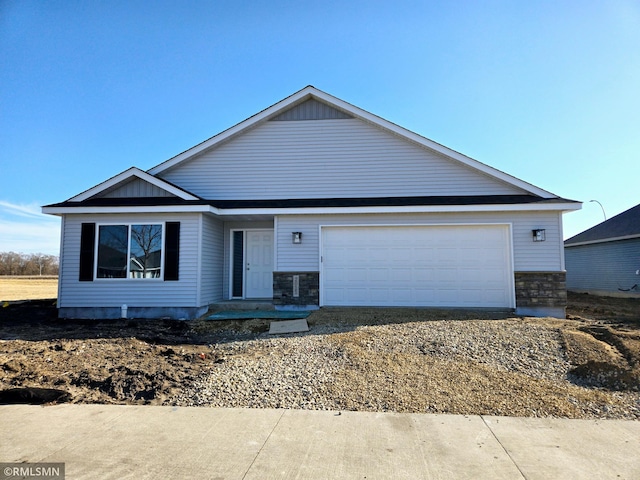 2003 Essler Dr, Saint Peter, MN 56082 - ranch-style house featuring an attached garage and stone siding