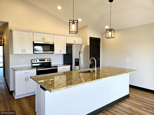 2003 Essler Dr, Saint Peter, MN 56082 - kitchen with appliances with stainless steel finishes, dark wood-style floors, white cabinetry, a center island with sink, and recessed lighting