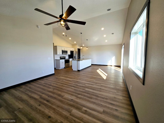 2003 Essler Dr, Saint Peter, MN 56082 - unfurnished living room with recessed lighting, dark wood-style floors, ceiling fan, and high vaulted ceiling
