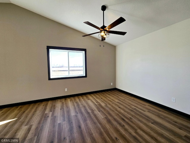 2003 Essler Dr, Saint Peter, MN 56082 - unfurnished room featuring lofted ceiling, ceiling fan, and dark wood-style floors