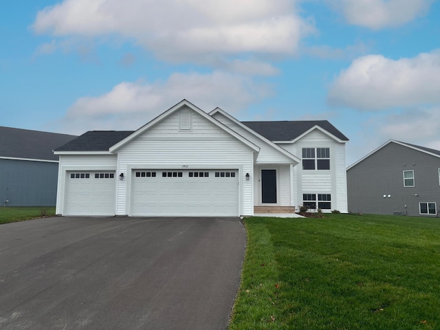 19916 English Ln N, Forest Lake, MN 55025 - view of front of house featuring asphalt driveway, a garage, and a front yard