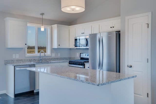 19916 English Ln N, Forest Lake, MN 55025 - kitchen featuring stainless steel appliances, lofted ceiling, white cabinetry, dark wood-style flooring, and a center island
