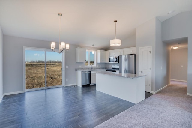 19916 English Ln N, Forest Lake, MN 55025 - kitchen with stainless steel appliances, white cabinets, a kitchen island, dark wood-style flooring, and vaulted ceiling