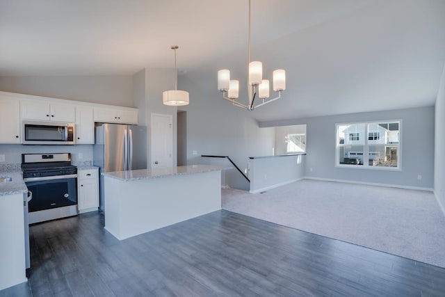 19916 English Ln N, Forest Lake, MN 55025 - kitchen featuring stainless steel appliances, white cabinetry, a kitchen island, dark wood-style floors, and high vaulted ceiling