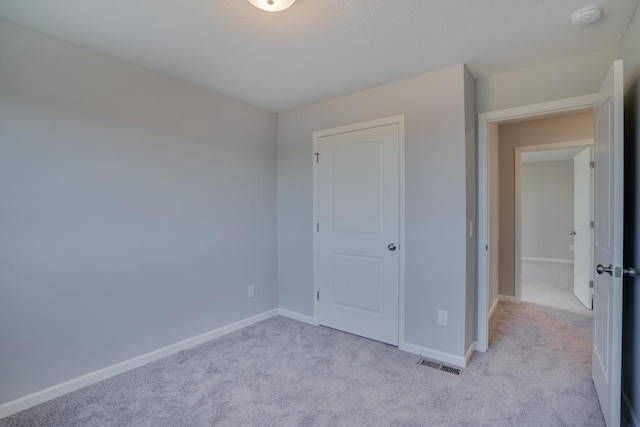 19916 English Ln N, Forest Lake, MN 55025 - unfurnished bedroom featuring light colored carpet