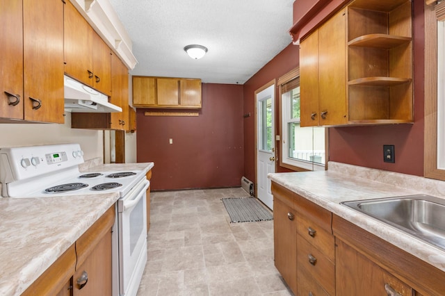 7 Pleasant Ave SE, Remer, MN 56672 - kitchen with electric range, under cabinet range hood, brown cabinets, and light countertops