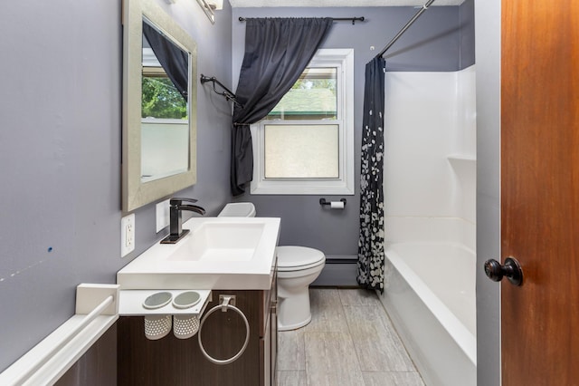7 Pleasant Ave SE, Remer, MN 56672 - bathroom featuring vanity, plenty of natural light, shower / bath combination with curtain, and baseboard heating