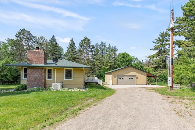 7 Pleasant Ave SE, Remer, MN 56672 - view of side of property with a garage, a chimney, a yard, driveway, and an outbuilding