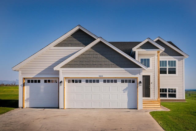 19926 English Ln N, Forest Lake, MN 55025 - view of front of house featuring an attached garage, concrete driveway, and a front yard