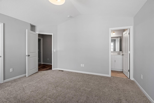 19926 English Ln N, Forest Lake, MN 55025 - unfurnished bedroom with carpet floors, vaulted ceiling, and ensuite bath