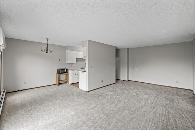 814 9th Ave S Unit 5, Hopkins, MN 55343 - unfurnished living room with a textured ceiling, a chandelier, light colored carpet, and baseboard heating