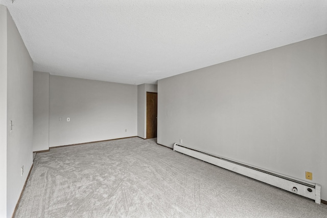 814 9th Ave S Unit 5, Hopkins, MN 55343 - spare room with a baseboard radiator, light colored carpet, and a textured ceiling