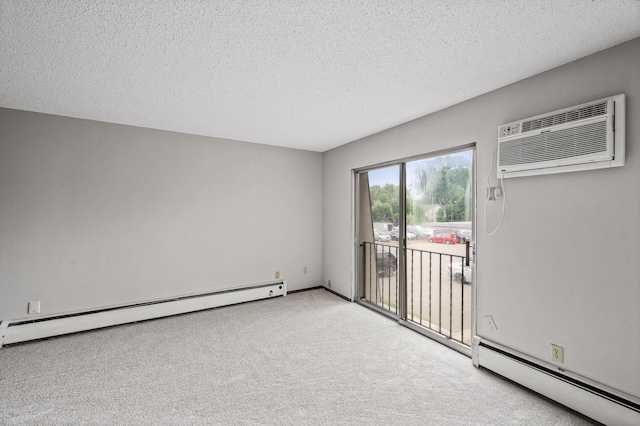 814 9th Ave S Unit 5, Hopkins, MN 55343 - carpeted empty room with baseboard heating, a wall mounted air conditioner, and a textured ceiling