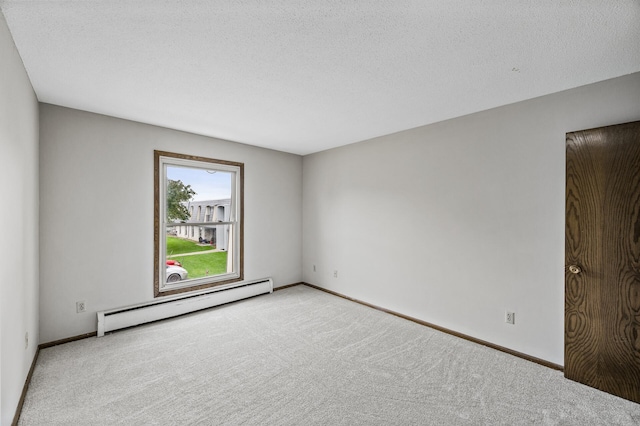 814 9th Ave S Unit 5, Hopkins, MN 55343 - carpeted spare room featuring a baseboard heating unit and a textured ceiling