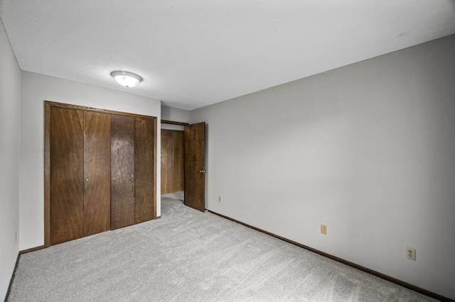 814 9th Ave S Unit 5, Hopkins, MN 55343 - unfurnished bedroom featuring light colored carpet and a closet