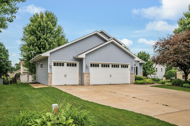121 Arbor St, Northfield, MN 55057 - view of front of home with a detached garage and board and batten siding