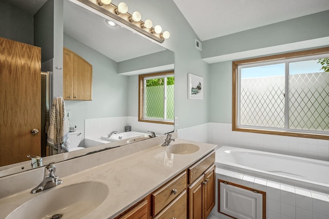 121 Arbor St, Northfield, MN 55057 - bathroom with a garden tub, a shower stall, double vanity, and vaulted ceiling