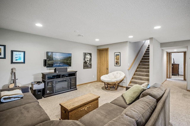 121 Arbor St, Northfield, MN 55057 - carpeted living area with stairway, a textured ceiling, and recessed lighting