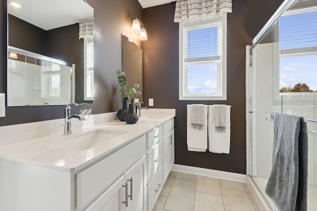 15165 Quince St NW, Andover, MN 55304 - bathroom featuring double vanity, tile patterned floors, and a stall shower