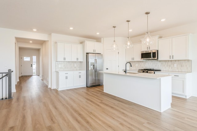 9734 49th St NE, Saint Michael, MN 55376 - kitchen with appliances with stainless steel finishes, decorative backsplash, white cabinets, light countertops, and recessed lighting
