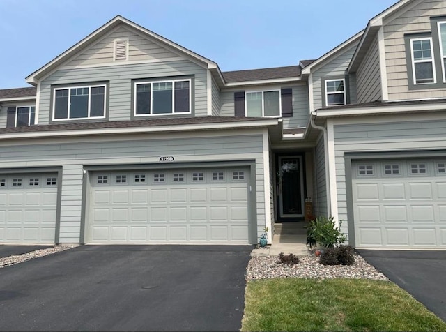 3129 Countryside Ave Unit D, Woodbury, MN 55129 - view of front of home with driveway and an attached garage