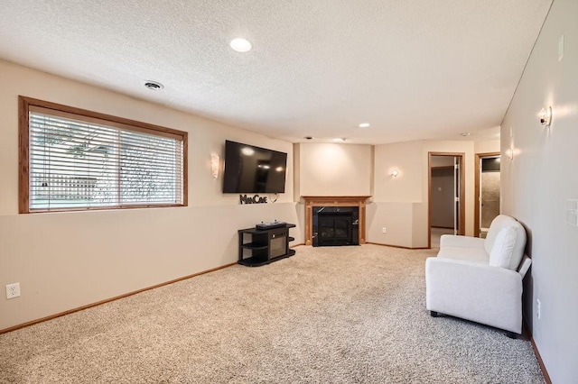 6788 Carlisle Curv, Shakopee, MN 55379 - carpeted living area featuring a textured ceiling, a fireplace with flush hearth, and recessed lighting