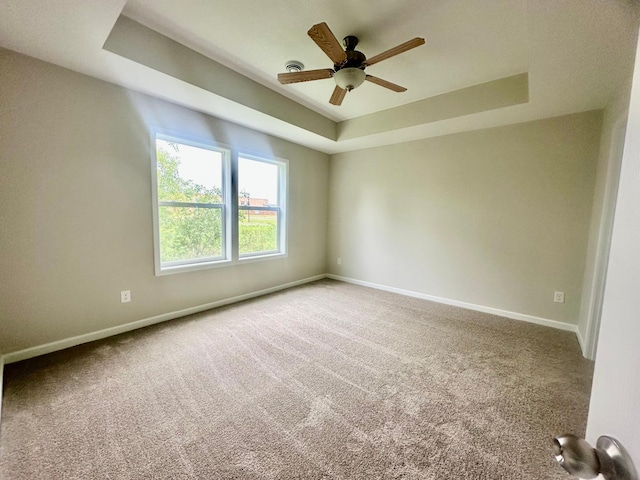 720 Cherrywood Ln NE, Isanti, MN 55040 - carpeted empty room with a tray ceiling and a ceiling fan
