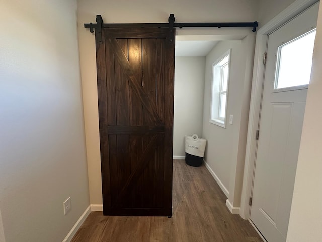 720 Cherrywood Ln NE, Isanti, MN 55040 - foyer with a barn door and wood finished floors