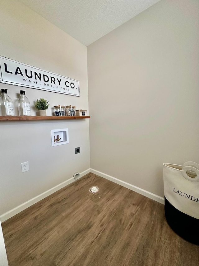 720 Cherrywood Ln NE, Isanti, MN 55040 - laundry area with hookup for a washing machine, electric dryer hookup, wood finished floors, and a textured ceiling