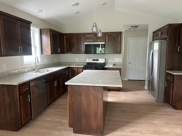 720 Cherrywood Ln NE, Isanti, MN 55040 - kitchen featuring appliances with stainless steel finishes, a center island, dark brown cabinets, light wood-type flooring, and lofted ceiling