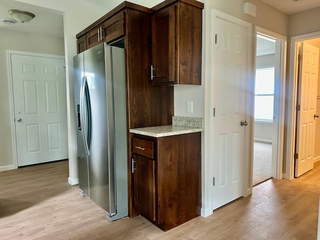 720 Cherrywood Ln NE, Isanti, MN 55040 - kitchen featuring stainless steel refrigerator with ice dispenser, light wood-style floors, and dark brown cabinetry