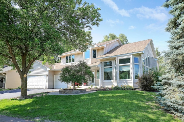 10902 Eagle Lake Blvd, Maple Grove, MN 55369 - view of front of property with driveway, an attached garage, a front yard, and roof with shingles