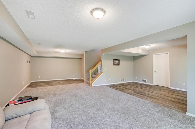 10902 Eagle Lake Blvd, Maple Grove, MN 55369 - unfurnished living room with carpet floors, stairway, and a textured ceiling