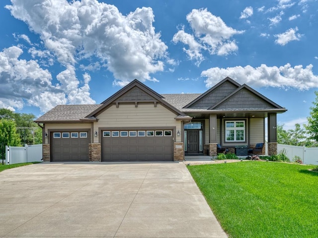 6937 94th St S, Cottage Grove, MN 55016 - craftsman inspired home with driveway, an attached garage, and a porch