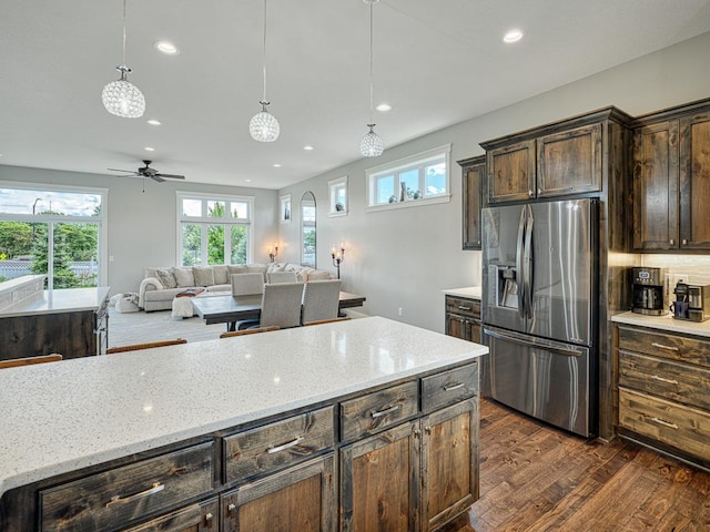 6937 94th St S, Cottage Grove, MN 55016 - kitchen featuring stainless steel fridge with ice dispenser, dark wood-style flooring, recessed lighting, dark brown cabinetry, and pendant lighting