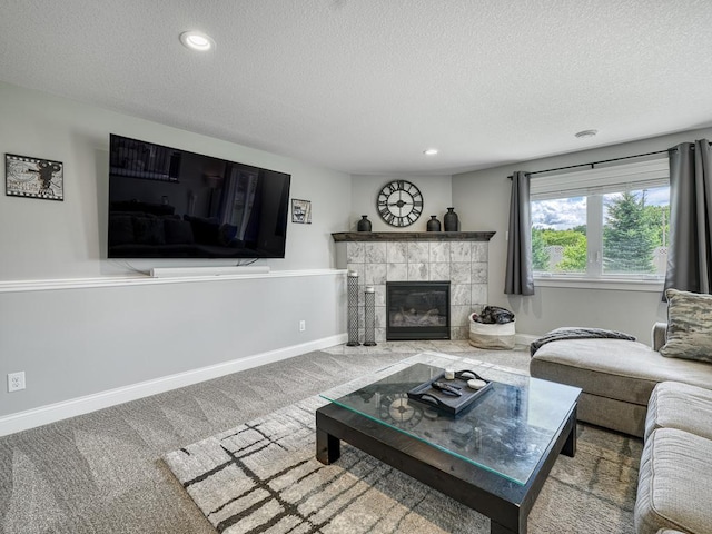 6937 94th St S, Cottage Grove, MN 55016 - living area with a textured ceiling, recessed lighting, a tiled fireplace, and carpet