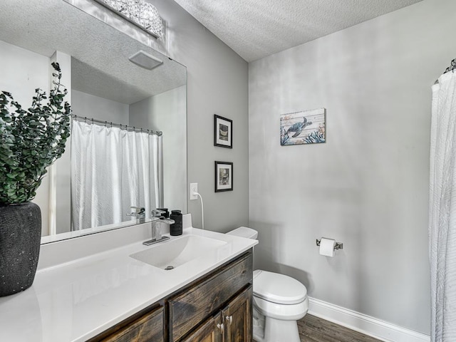 6937 94th St S, Cottage Grove, MN 55016 - full bathroom featuring wood finished floors, a textured ceiling, and vanity
